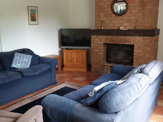Lounge with wood burner and smart TV with DVD player